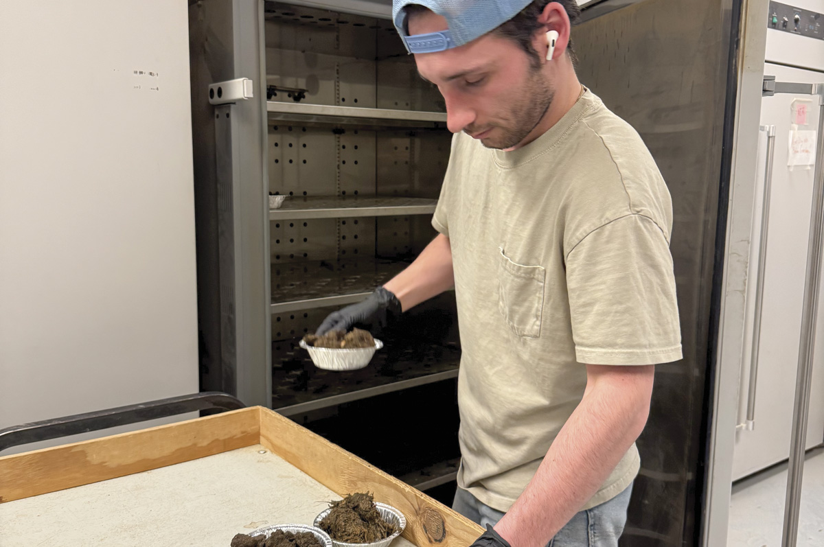 61654-kern-Royce-Austen-Loading-Manure-Samples-into-the-Oven.jpg