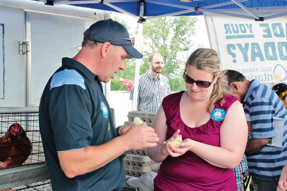 Visitor holding a chick