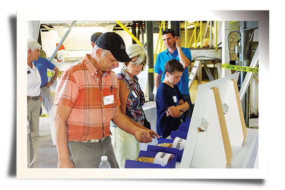 Mill tour guests looking at product samples