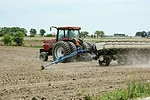 Tractor planting corn