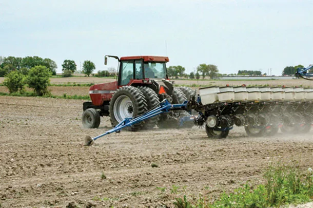 Tractor planting corn