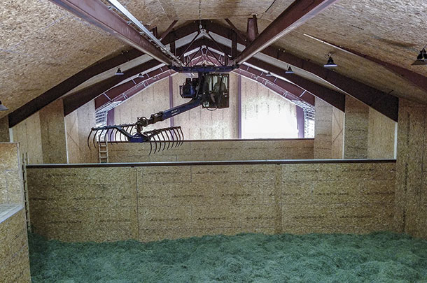 The drying system includes a hay crane to distribute hay among the boxes