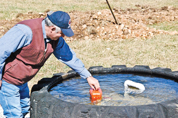 Squibb checking the float on water tank