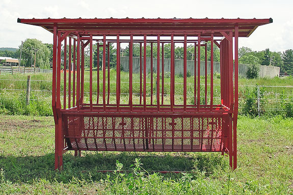 covered cradle round bale feeder