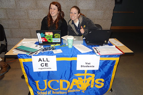 Students helping at the registration desk