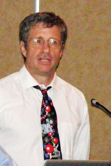 Steve Carlson speaks at a conference about salmonella-resistant genetics.