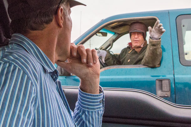 An employee checks in with Ned Tranel