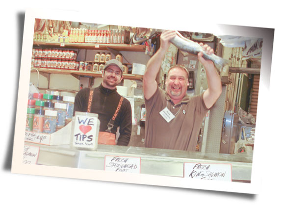Wisconsin dairyman Mark Diedrich catches a “flying fish” at Pike Place Market in downtown Seattle. Attendees toured the market and met the “world-famous” Pike Place Fish Throwers.