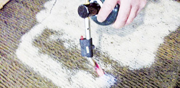 On normal, clean concrete, heating the surface with a torch produces very little change in appearance, color or texture. Organic material simply burns away. However, if lime has created a residue on the floor, it swells, turns white and hardens upon heating, adhering tightly to the floor. 