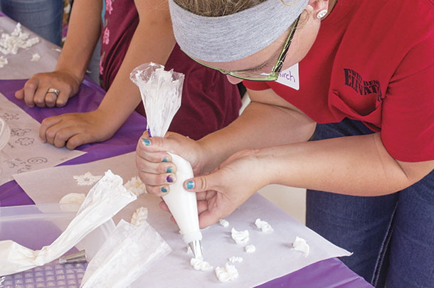 Honds-on activity, participants practiced cupcake decorating