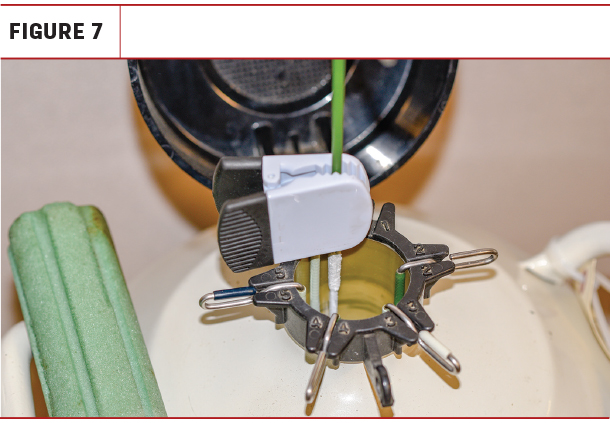 a clip to secure canisters