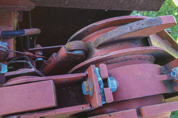 Roller and take-up arm cam