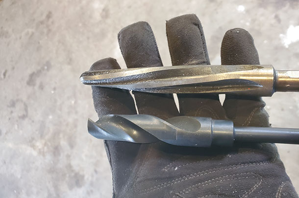 Holding a 3/4-inch drill bit and a 3/4-inch reamer