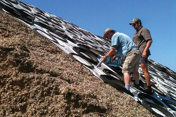 Core testing into the surface of the pile