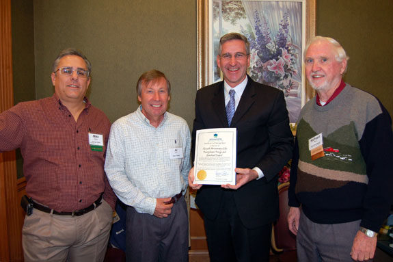 Pennsylvania Secretary of Agriculture Russell Redding presents a special certificate to board members