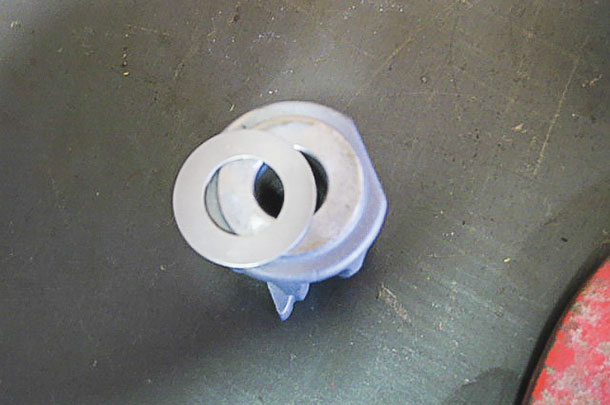 A shim washer on top of the billhook pioion gear