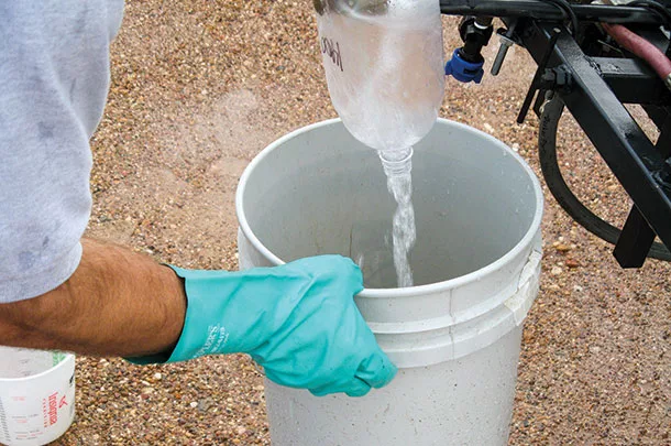 Uses soda bottle as a funnel and directs the spary into a bucket
