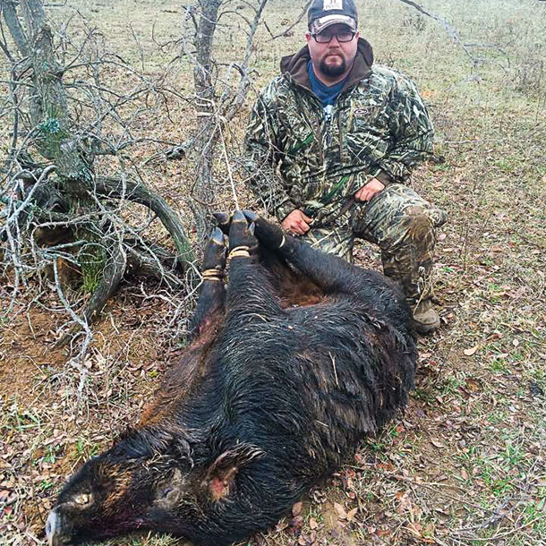 Chris Wilson a rancher and hunter with a feral hog