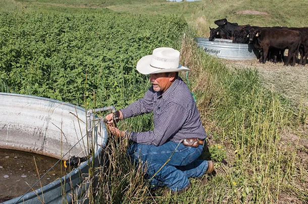 Steve Grudzinski works with water source