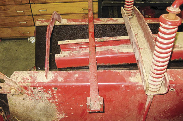 A tool from New Holland to bend the knife arm.