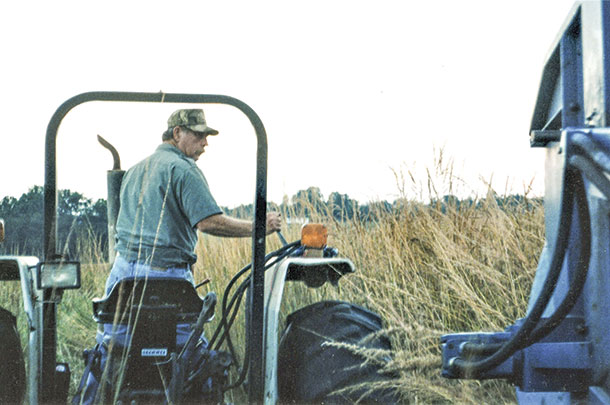 John harvesting indiangrass seed 