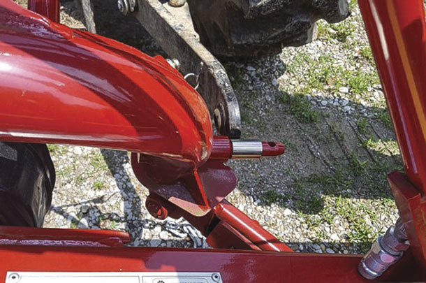 Back the tractor up to the disc mower, aligning the indide of the lift arm ball witht he shoulder of the hitch pin