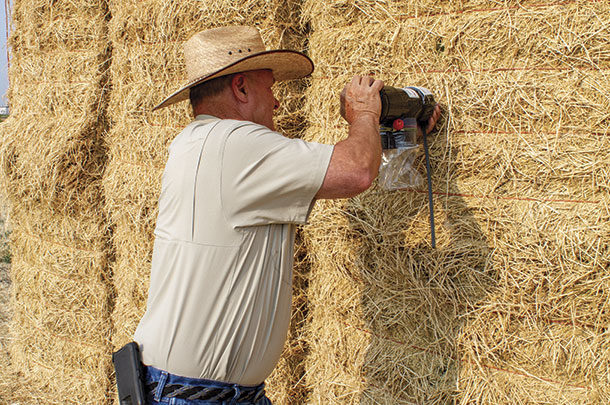 Glenn Shewmaker, uses manual hay probe