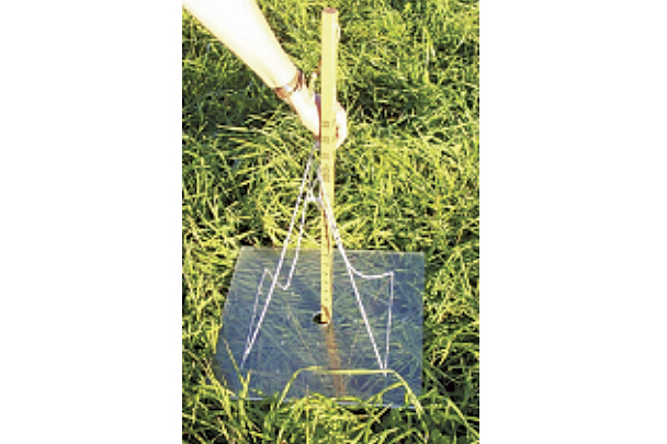 A resting plate meter is being used to measure pasture height