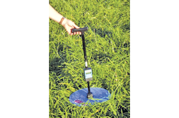 A commercial rising plae meter is being used to measure pasture height with forage mass