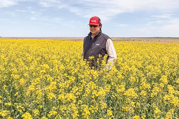 Preston Simon stands in Canola